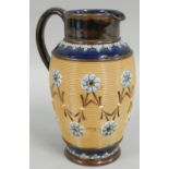 A Doulton Lambeth stoneware jug, with impressed floral decoration, impressed marks, 21 cm.