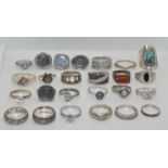 A quantity of silver rings, some gemset.