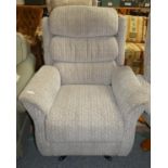 An electric operated reclining chair in chenille fabric.