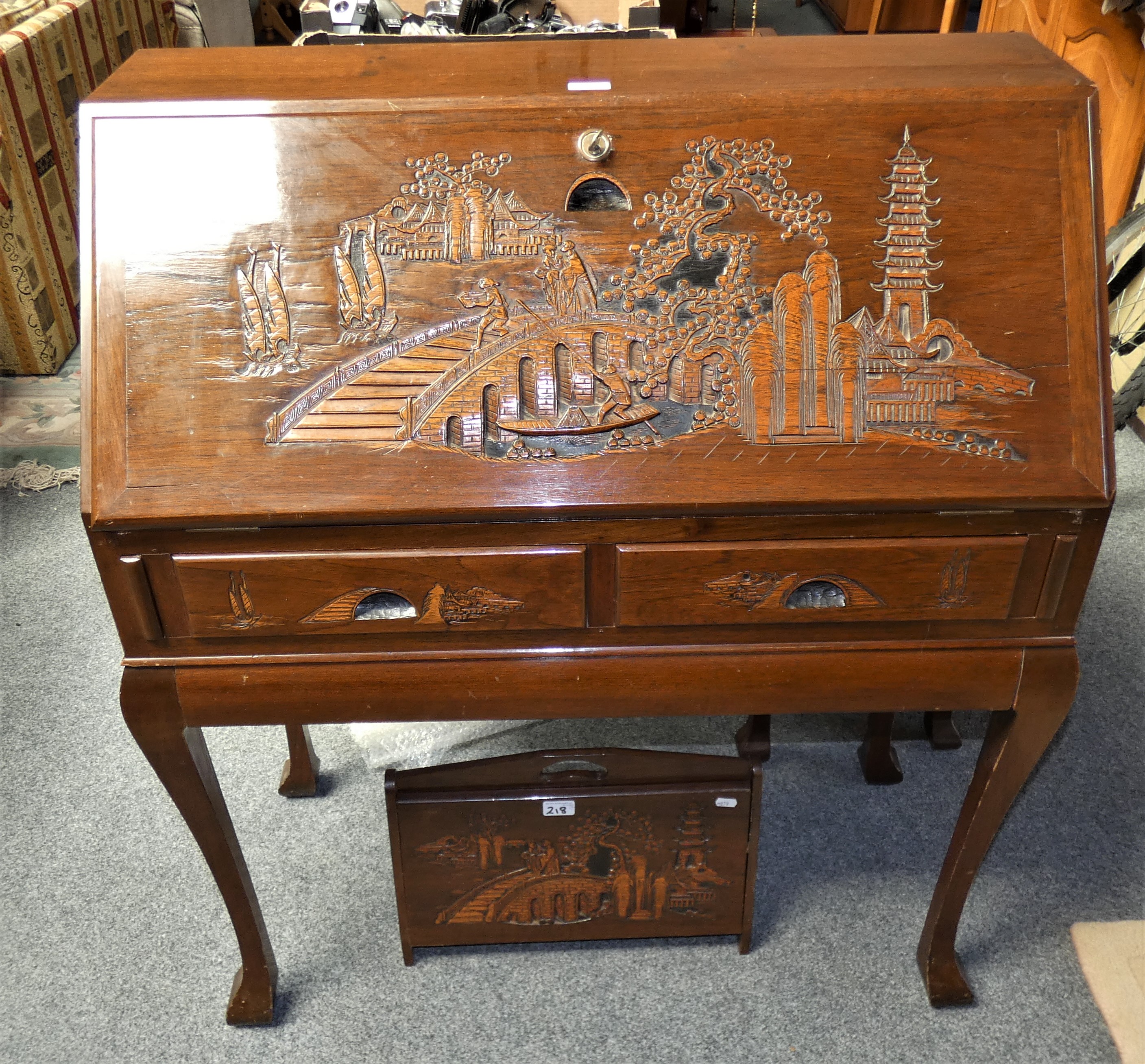 A mid 20th century bureau with carved Oriental scenes, together with a matching magazine rack, - Image 3 of 4