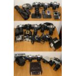 A collection of cameras, lenses and accessories in three boxes, to include Sony Handycam, Humart