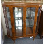 A mid 20th century bow fronted glazed cabinet.