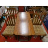 An oval drop leaf gate leg dining table, 150 x 110 cm, together with four chairs with drop in