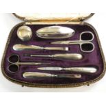 A silver mounted manicure set, Birmingham 1925, replacement scissors, case.