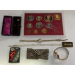 A 9ct gold and diamond stick pin, case, a 9ct gold and jade pendant, two 9ct gold watch heads and