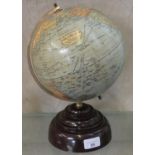 An 8 inch terrestrial globe Geographia, raised on a Bakelite pedestal base, height 31cm.