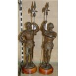 A pair of spelter Halberdiers on oak bases, height 43cm (2).