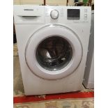 A Samsung Ecobubble 7kg washing machine, model WF70F5E2W2W.