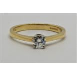 An 18ct gold single stone diamond ring, claw set with a brilliant cut stone weighing approximately