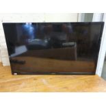 A Toshiba colour television, model 32D3653DB, with remote control.