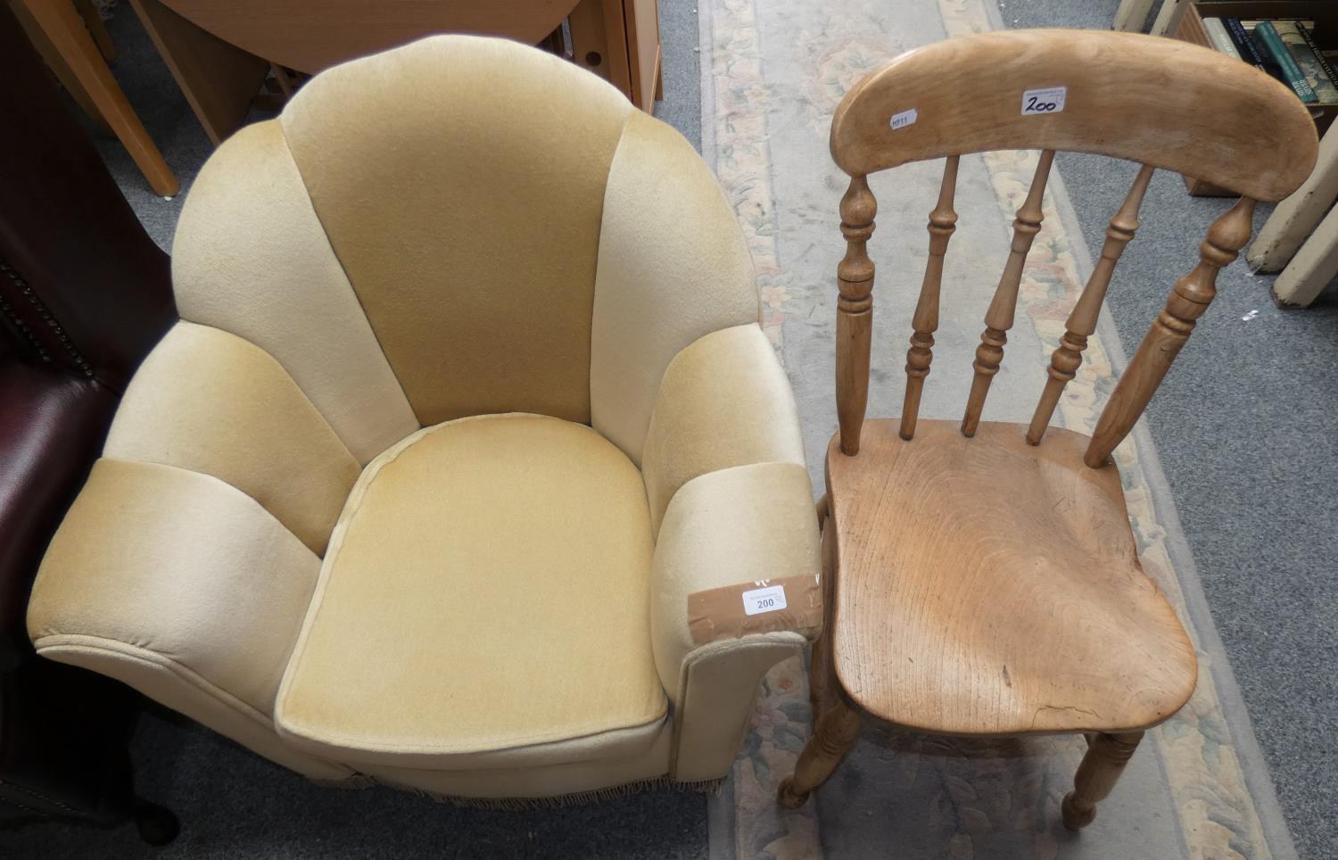 A tub chair in lemon coloured fabric, 70cm tall, 76cm wide, together with a pine dining chair (2).