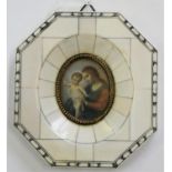 A portrait miniature of Madonna and child, signed, overall 12 x 11 cm.