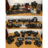 Three boxes of assorted cameras, camera bodies and lenses, to include Praktica Super TL, Minolta,