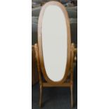 A modern freestanding swivel dressing mirror, 151cm tall.