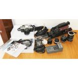 A collection of cameras and accessories, to include a Canon AE-1, Hoya 62mm + 55mm, skylight lenses,
