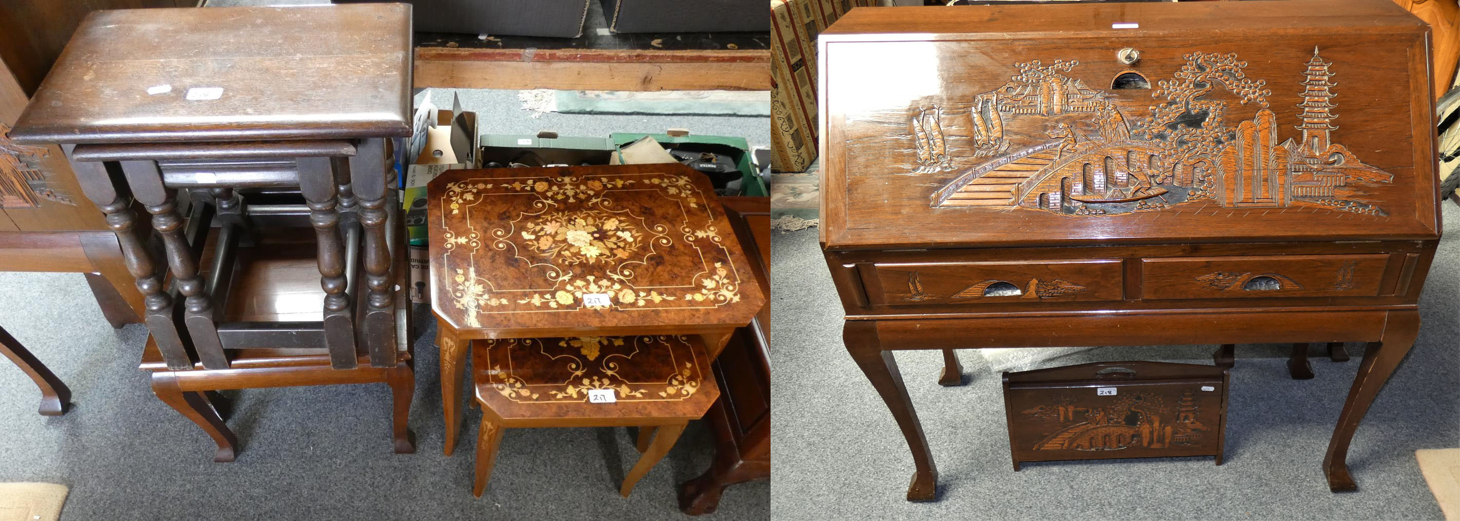 A mid 20th century bureau with carved Oriental scenes, together with a matching magazine rack,