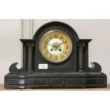 An Edwardian black slate mantel clock.