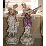 A pair of Capodimonte figurines, one with mandolin and the other with tambourine, height 47cm,