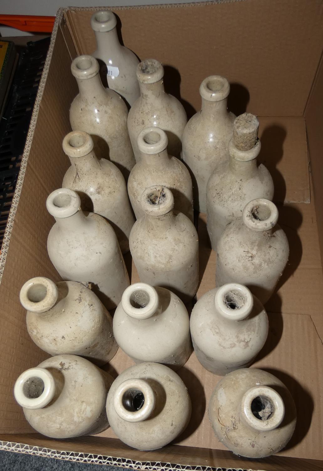 Sixteen glazed earthenware bottles, stamped M.K.M.0.5L. (16).