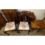 A pair of mahogany corner wall cupboards with inlaid doors, a pair of mahogany dining chairs and a