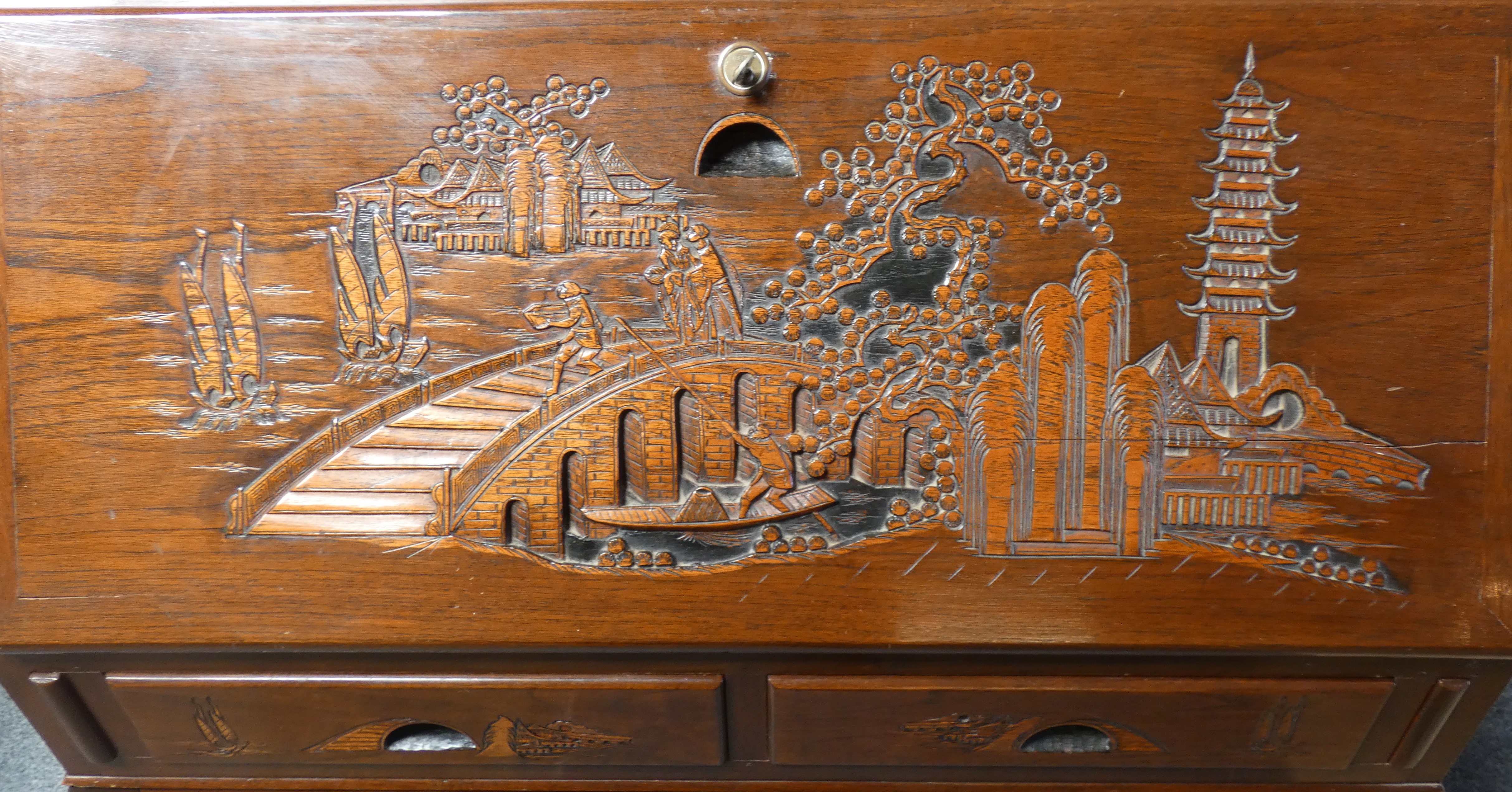 A mid 20th century bureau with carved Oriental scenes, together with a matching magazine rack, - Image 4 of 4