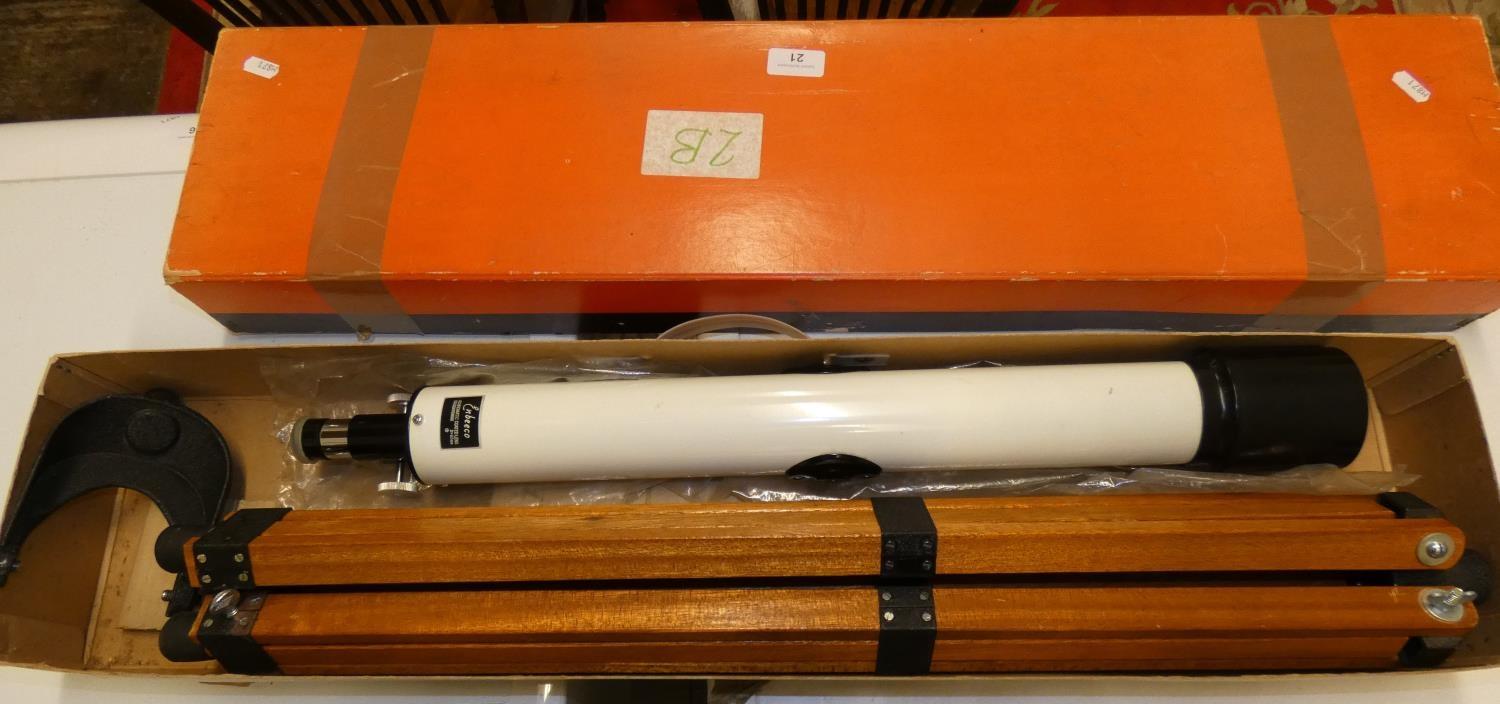 A boxed Enbeeco achromatic coated lens telescope, with tripod base.