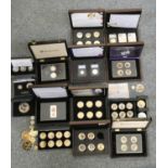 A quantity of cupro nickle and silver coins, some gilded and enamelled, mainly cased,