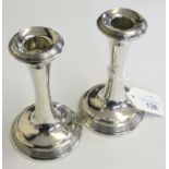 A pair of silver candlesticks, Birmingham 1911, 12cm, loaded