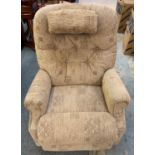 A reclining armchair in light brown fabric.