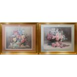 A pair of gilt framed floral prints, frames 82x96cm with glass.