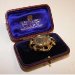 A Victorian gold and hair memorial brooch, repaired, case