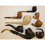 A collection of pipes, to include a Meerschaum example carved as a lady's head, cased, a Crystal