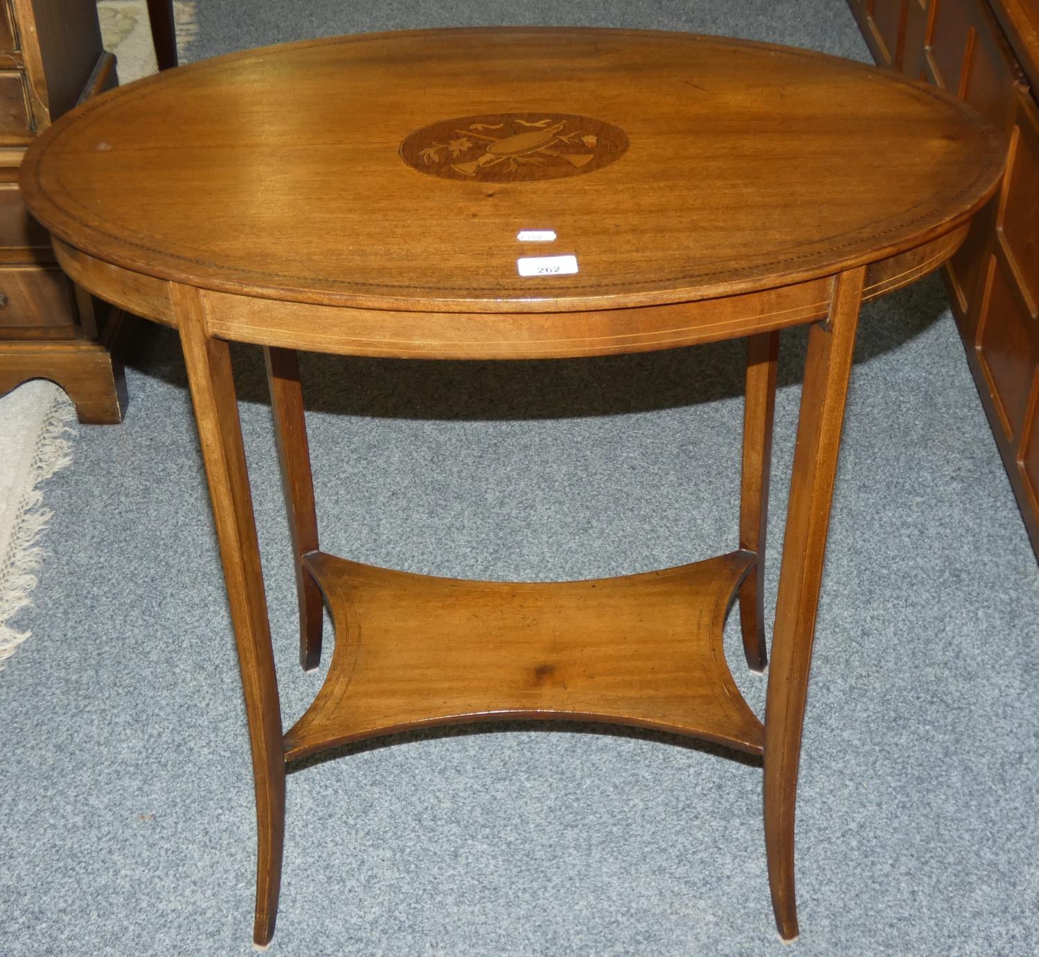 An Edwardian mahogany inlaid oval occasional table with under tier