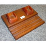 An Art Deco oak carvacraft Bakelite desk stand.