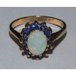 A 9ct gold opal and sapphire cluster ring, 2.5gms, size L1/2