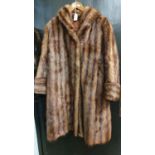 A ladies fur coat and a fake fur jacket (2).
