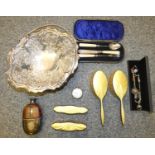 A yellow enamel and silver four piece dressing table set, Birmingham 1931, a leather, glass and