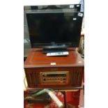 A Vintage Collection combination, record/CD/radio together with a Panasonic TX L19E3B television