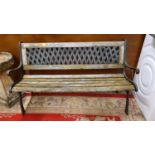 A cast alloy and wood slat garden bench.
