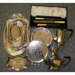 A three piece electroplated tea service and other plated wares.