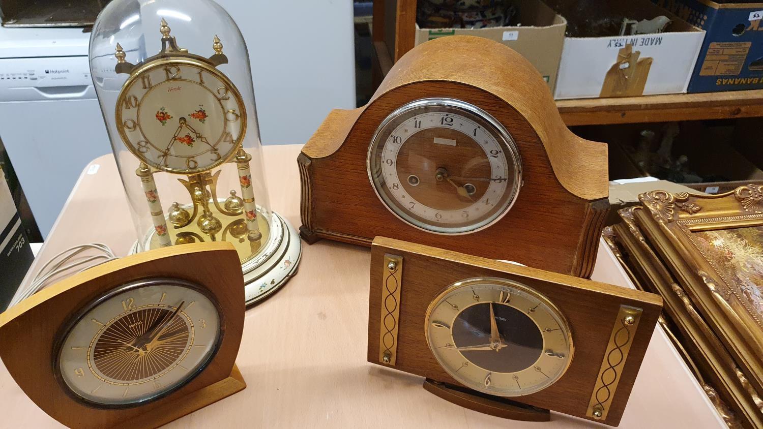 A Kundo white painted brass Anniversary clock, a Metamec clock, two other clocks and 3 oil on