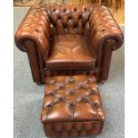 A Chesterfield style armchair in brown button back leather with similar box footstool (2).