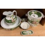 A dressing table wash set in florally decorated white and green comprising, jug and bowl, slop
