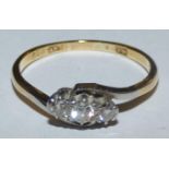 An 18ct gold three stone diamond ring, approximately 0.20cts, weight 2.7gms, size P1/2