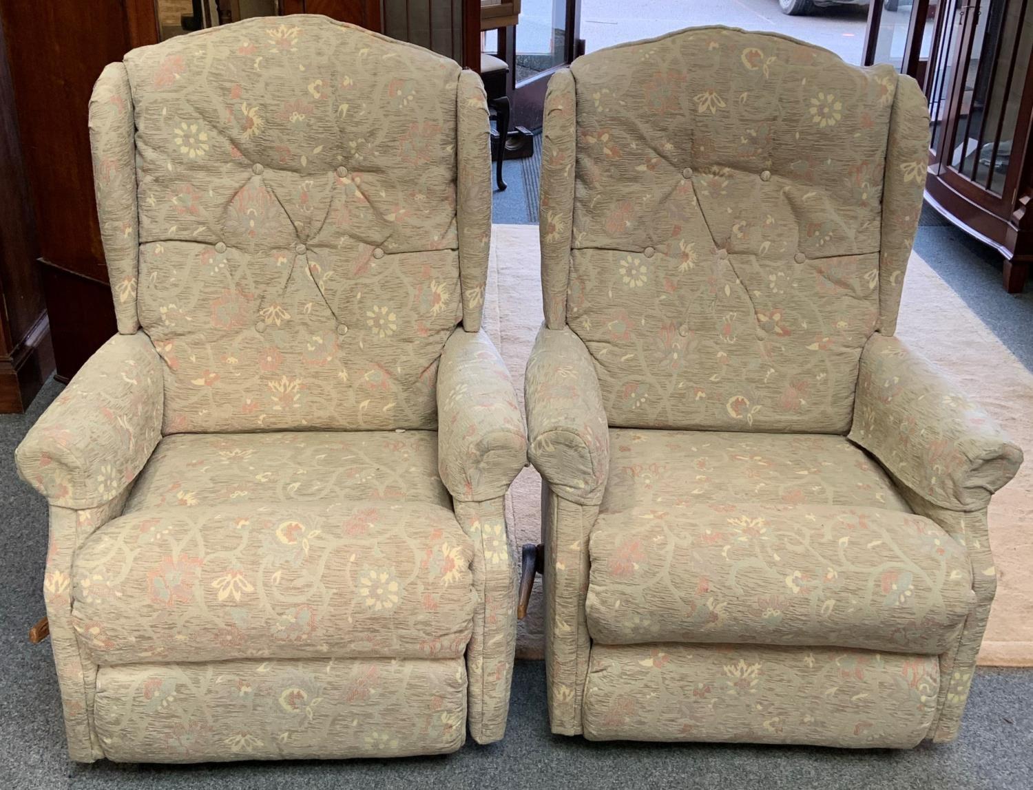 A pair of manual reclining armchairs.