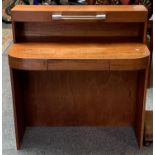An unusual art deco writing desk, the illuminated curved top with raised back.
