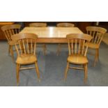 A pine kitchen table 152 x 92 cm, together with a set of 6 spindle back chairs (7).