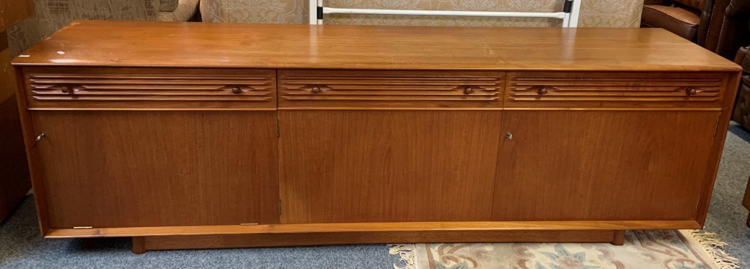 A low teak sideboard from Websters of Brighouse, 198 x 60 cm comprising of 3 drawers over 3