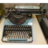 An early 'Bar-lock' typewriter in light blue colour.