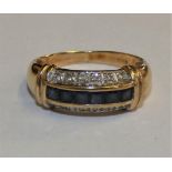 A 9ct gold sapphire and diamond dress ring, 2.6gms, size N